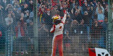 Scott McLaughlin on fence in front of fans after Supercars race win at Pukekohe Park Raceway