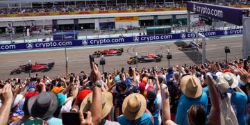 Formula 1 cars on race track in front of fans