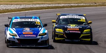 Two Mazda RX8s racing on track